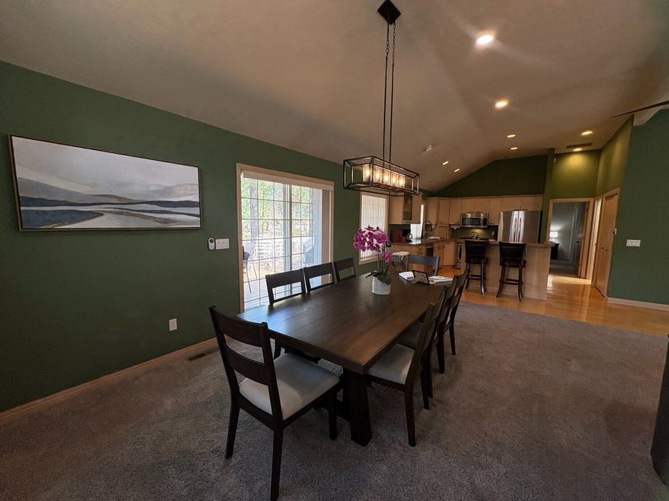 Gather around your elegant dining table for memorable meals with loved ones in this beautifully appointed open-concept space.