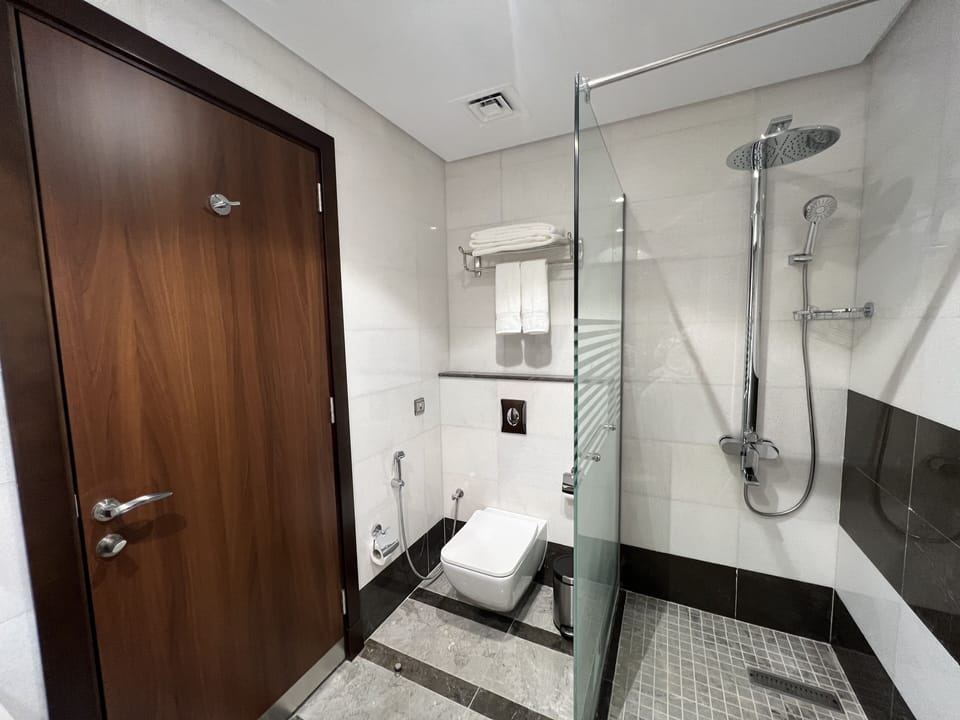 Shower, slippers, bidet, towels
