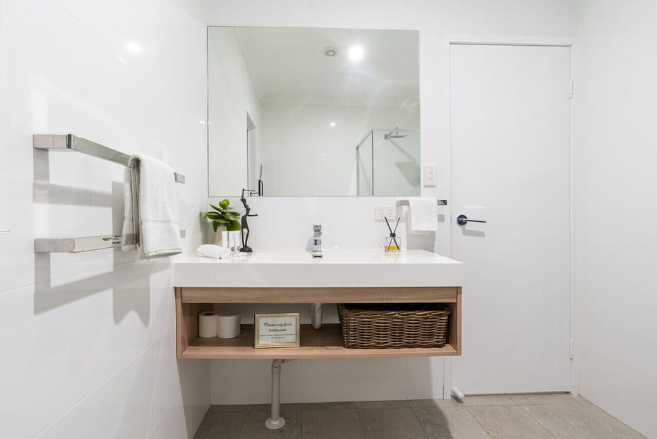 A clean and modern bathroom with a minimalist vanity setup.