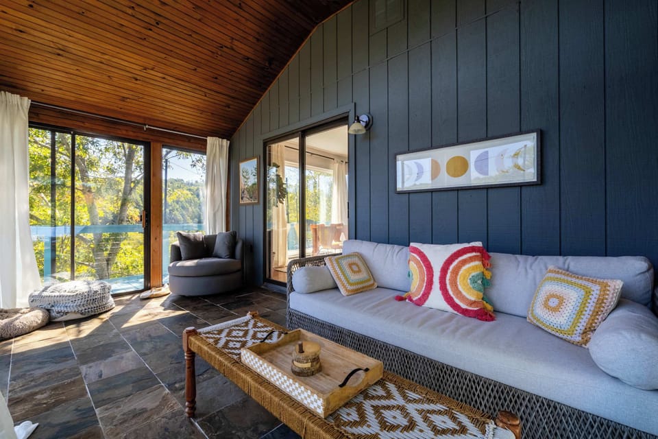 Find your favorite seat in the sunroom and let the wall of windows bring the forest right to you — this is where you'll want to spend your mornings.