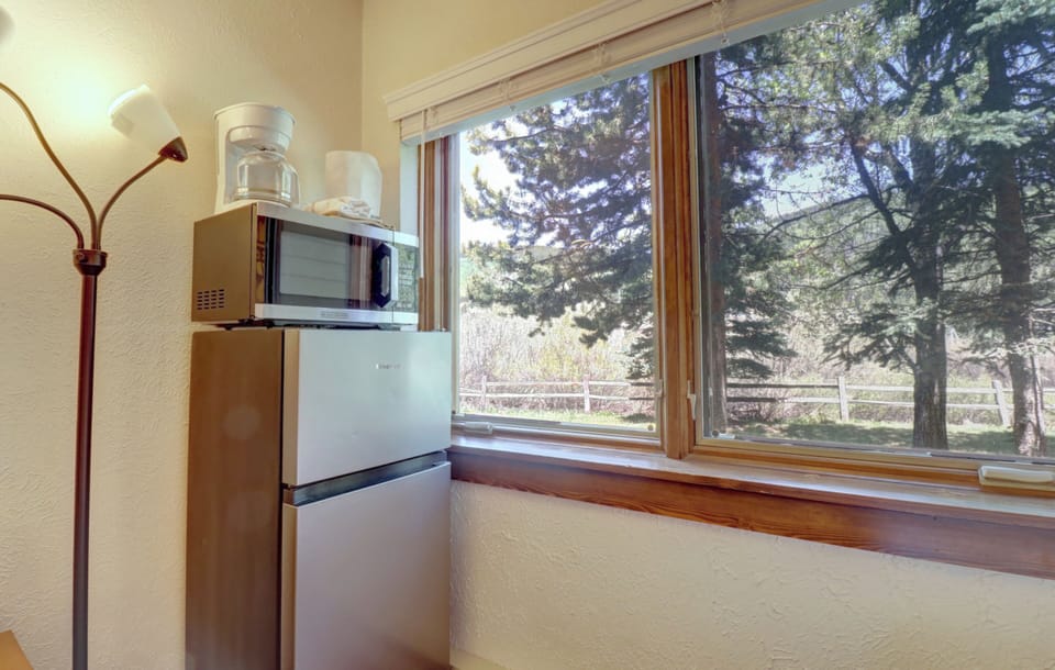 A coffee maker, microwave, and mini fridge provided in the room.