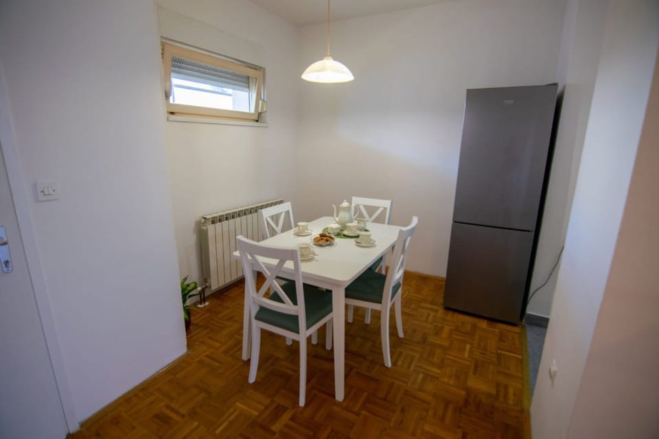 Family Apartment, 2 Bedrooms, Balcony, Courtyard View | In-room dining