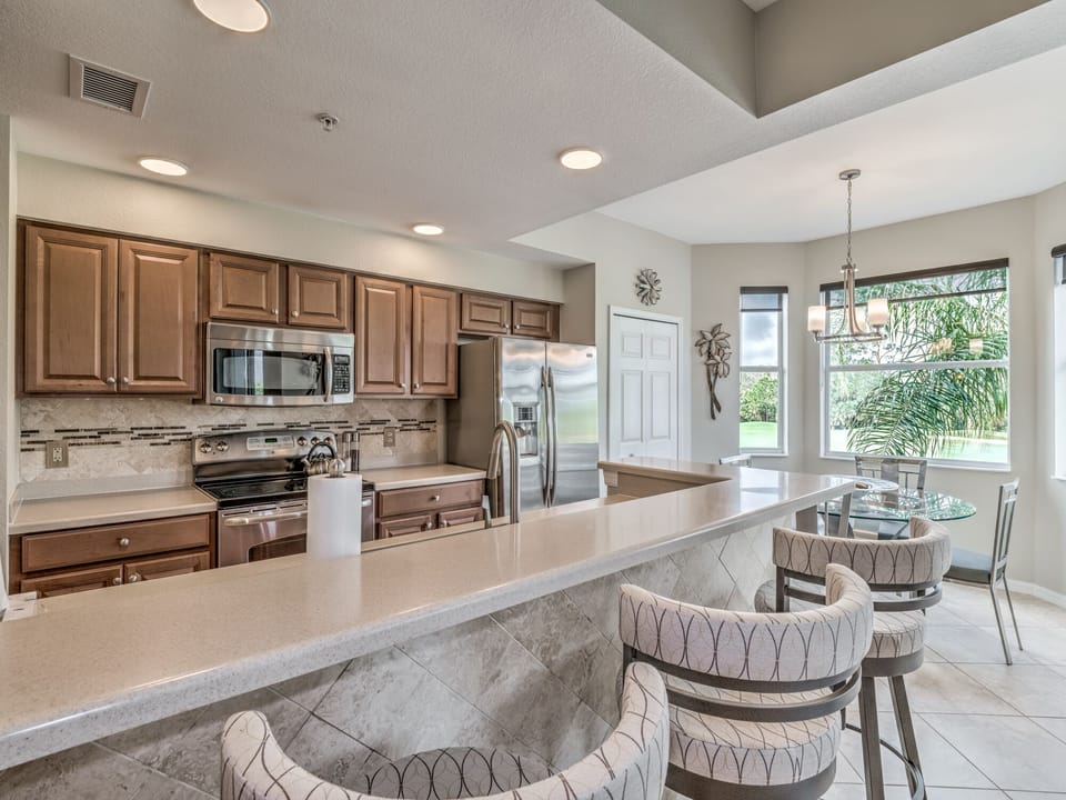 Fully stocked kitchen with under counter bar lights and dimmer lighting