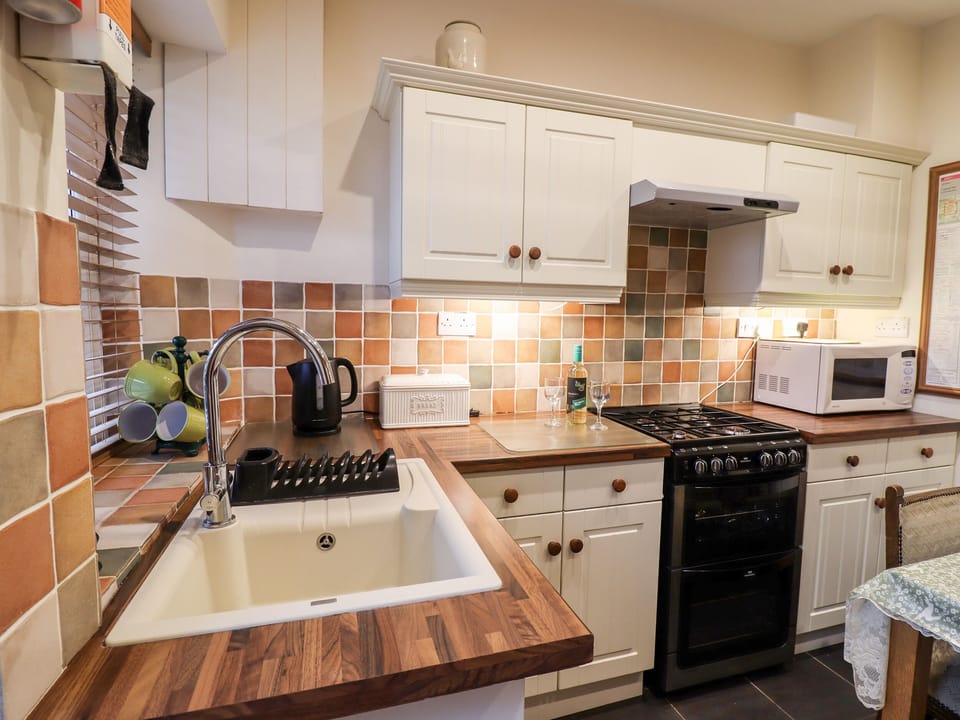 Fridge, electric kettle, toaster, cookware/dishes/utensils