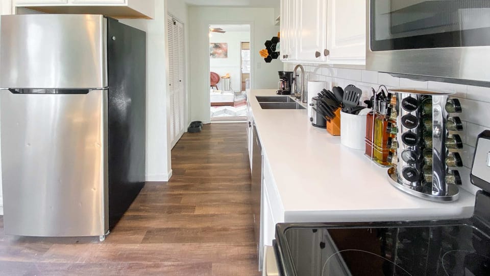 Newly renovated kitchen. View from the back door towards the living room