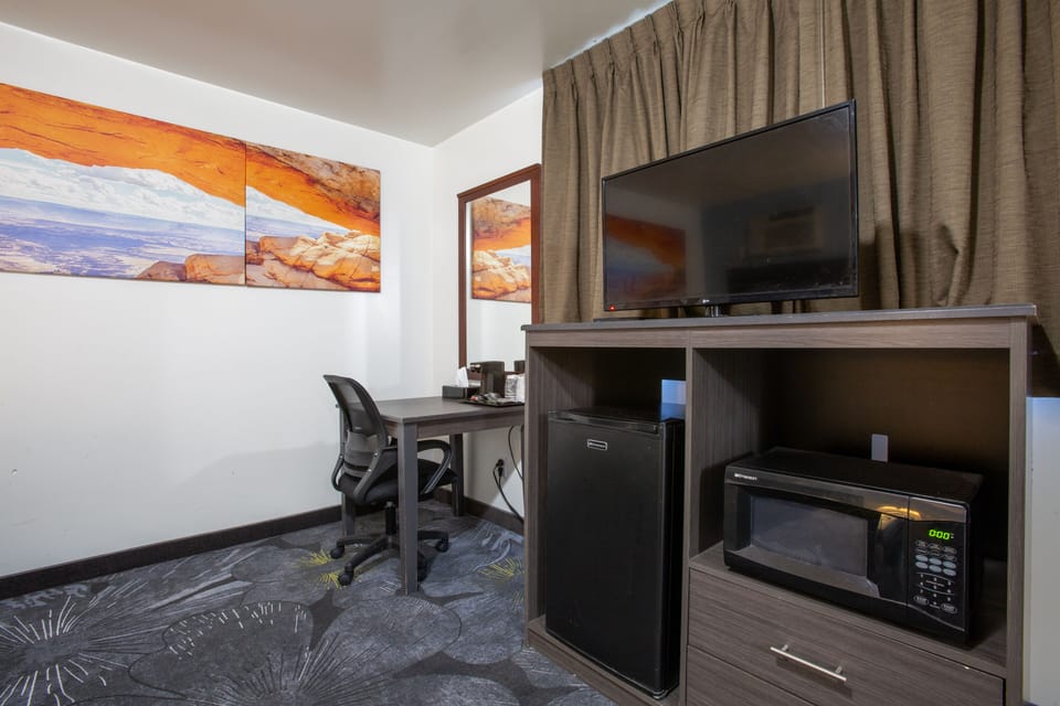 Room, 2 Queen Beds, Non Smoking, Refrigerator & Microwave | Living area | 32-inch flat-screen TV with cable channels, TV