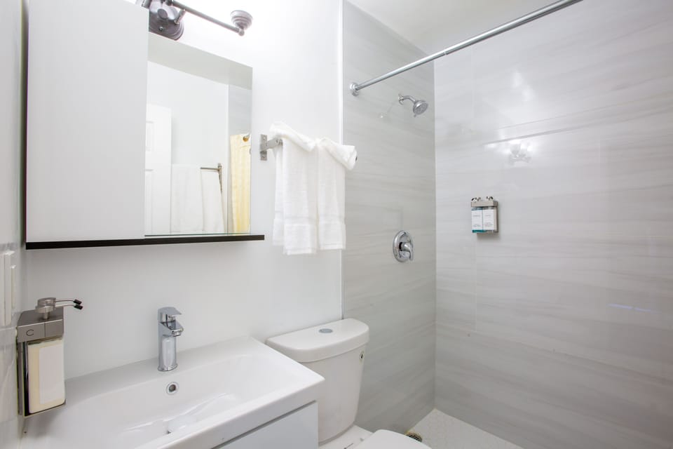 Room, 2 Queen Beds, Non Smoking, Refrigerator & Microwave | Bathroom | Shower, free toiletries, hair dryer (on request), towels