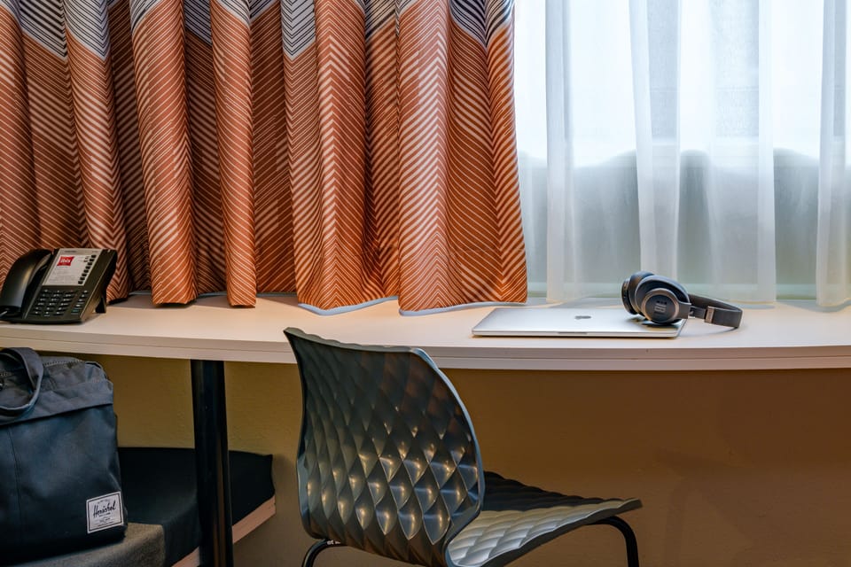 Hypo-allergenic bedding, desk, blackout drapes, soundproofing