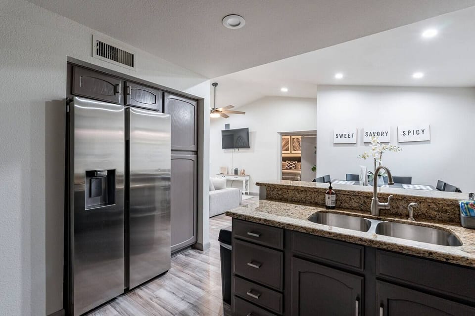 Enjoy a fully updated kitchen featuring sleek stainless steel appliances. ~ Perfect Staycation