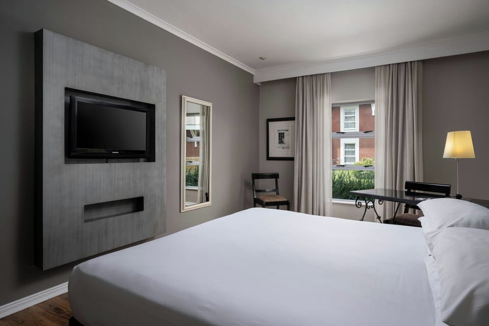 Room, 1 King Bed | In-room safe, desk, iron/ironing board (on request), cribs (free)