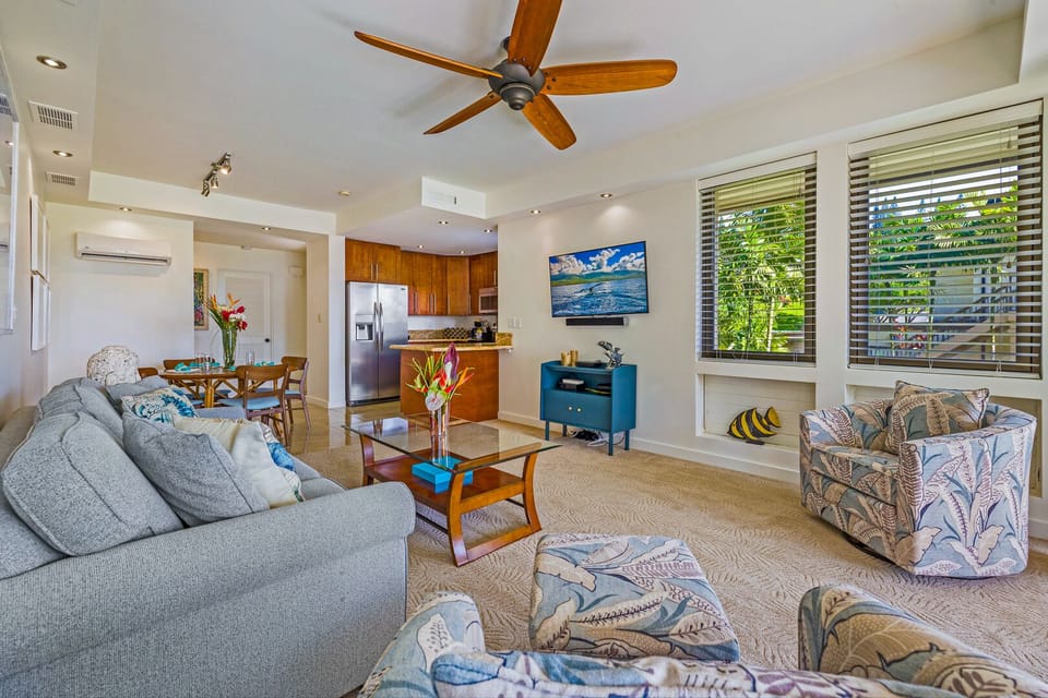 Spacious open-concept layout with modern coastal decor, perfect for entertaining or relaxing after a day at Kapalua Bay or nearby golf courses.