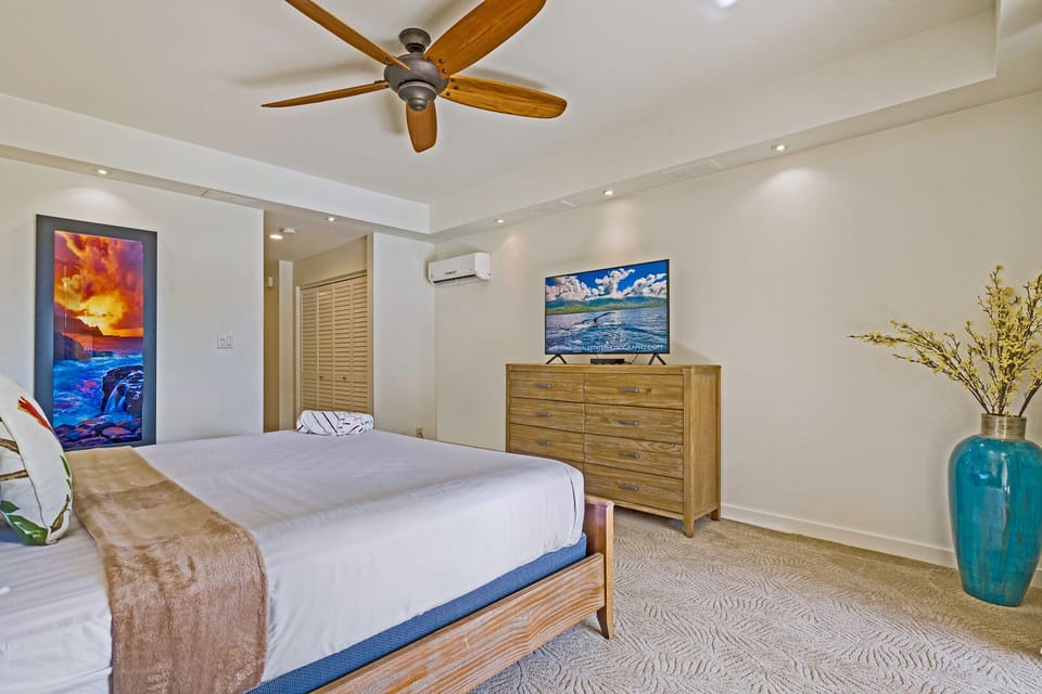 Restful bedroom retreat featuring a king bed, stylish furnishings, smart TV, and A/C—perfect for unwinding after a beach or hiking adventure.