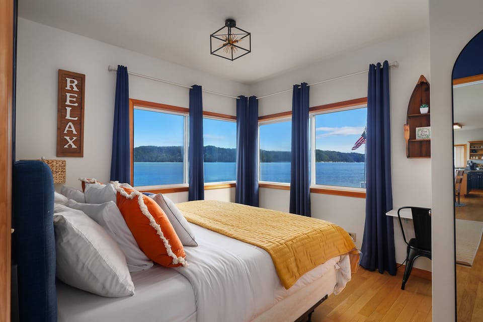 Wake up to panoramic views of Hood Canal—our master bedroom is the perfect blend of comfort and scenery. Blackout curtains, plush robes and more.