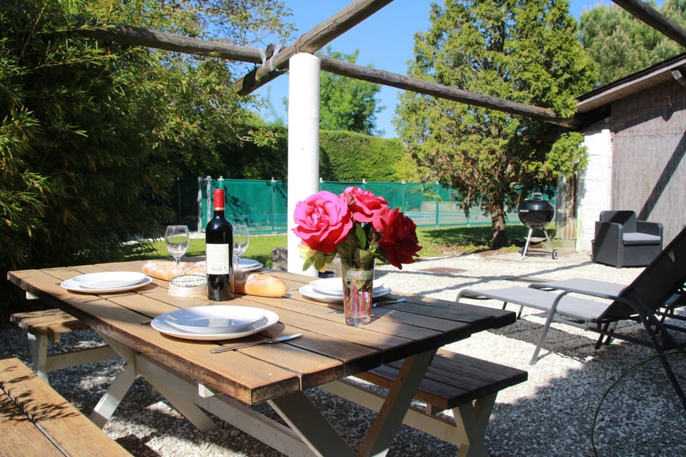 The private dining area overlooks the pool