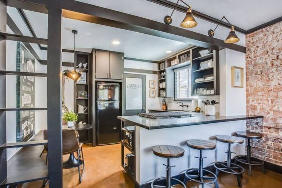 Fully equipped kitchen with bar seating and smooth flow into the main space.