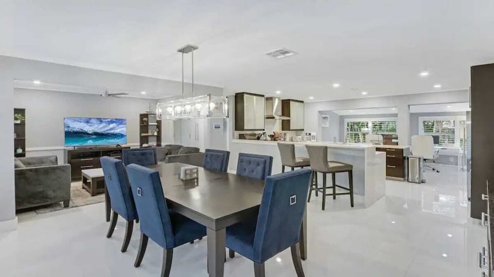 Gather in the elegant dining area, perfect for enjoying meals together in a comfortable and stylish setting