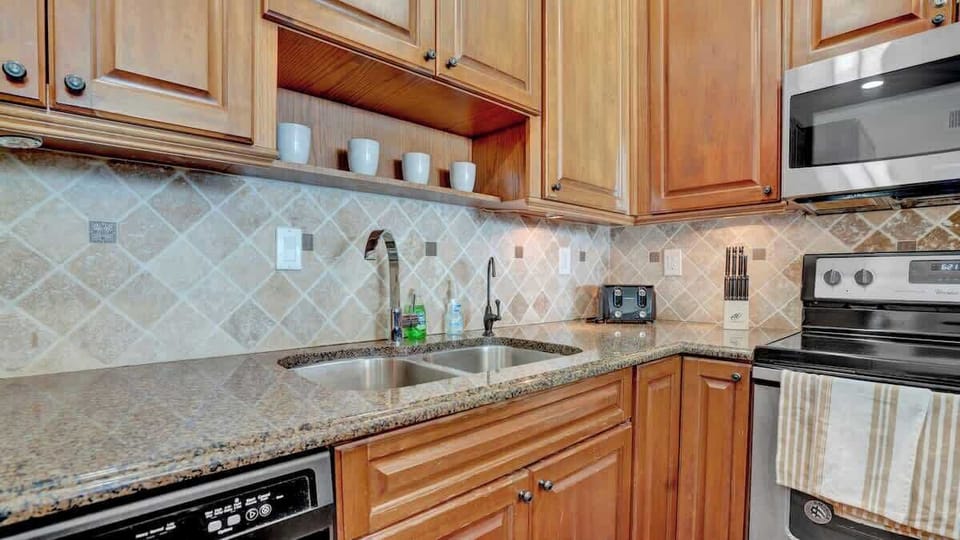 Fully equipped kitchen with modern appliances and everything needed for home-style meals.