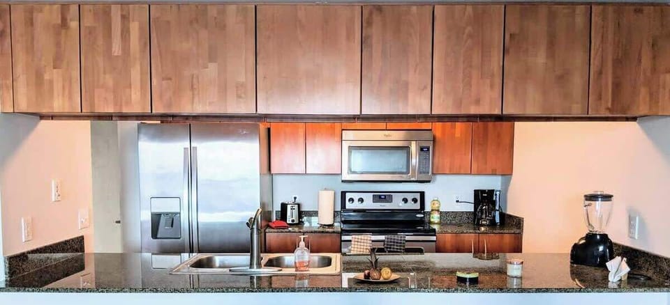 Fully equipped kitchen area with appliances and cookware