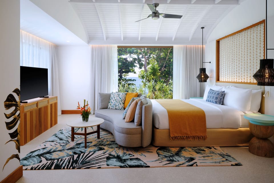 Signature Suite, 1 King Bed, Patio, Sea View | Minibar, in-room safe, desk, laptop workspace