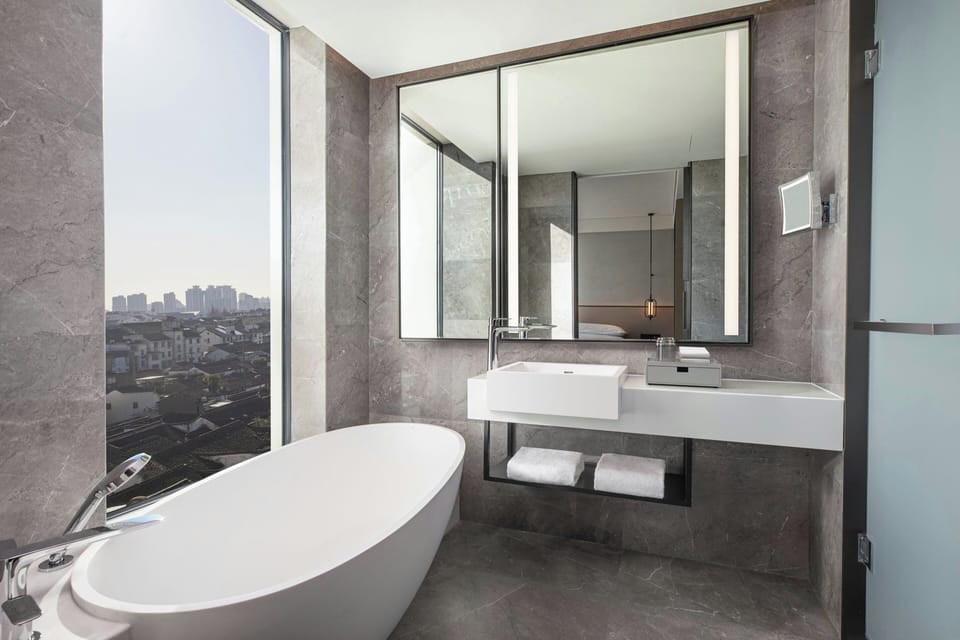 Basic Suite, 1 King Bed, City View | Living room | Flat-screen TV