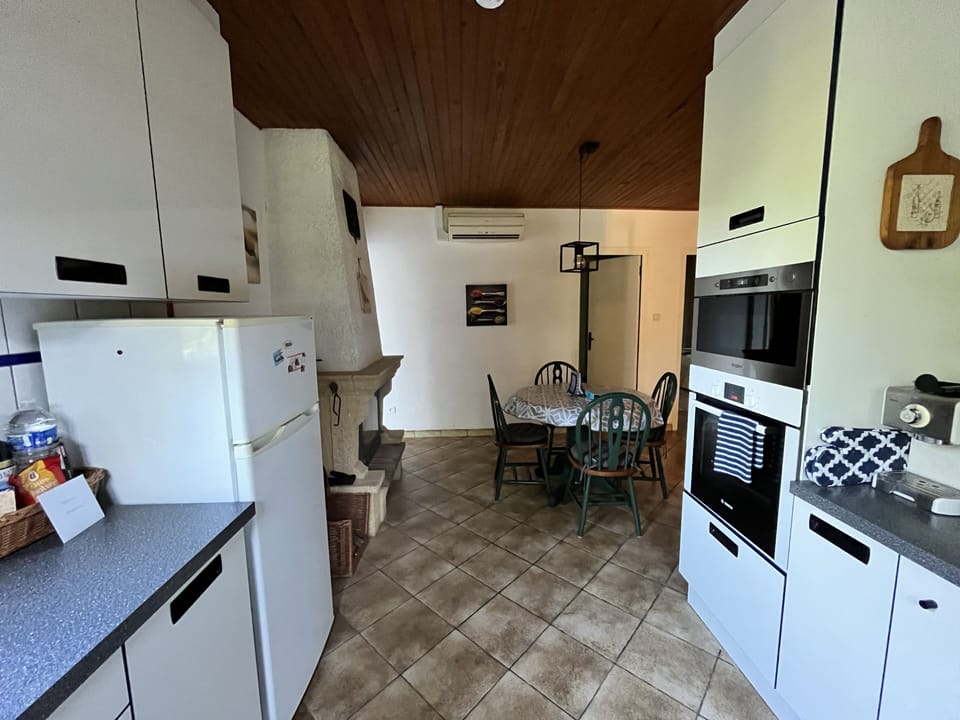 Kitchen with dining table and fireplace