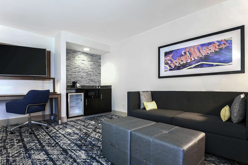 Studio Suite, 1 King Bed, Corner | Living area | 55-inch flat-screen TV with digital channels, TV