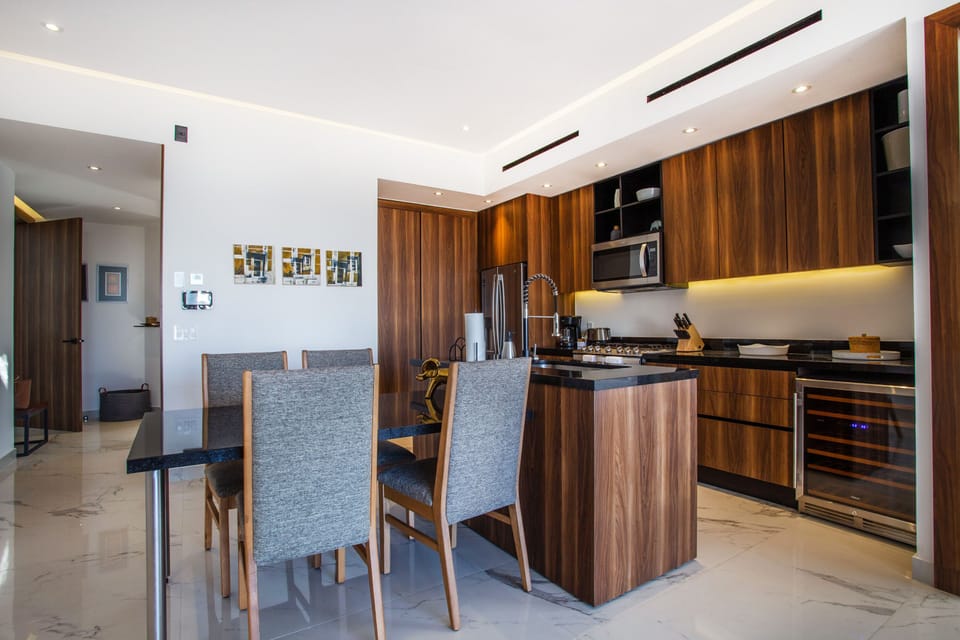The kitchen features a full size refrigerator, stove, oven and dishwasher