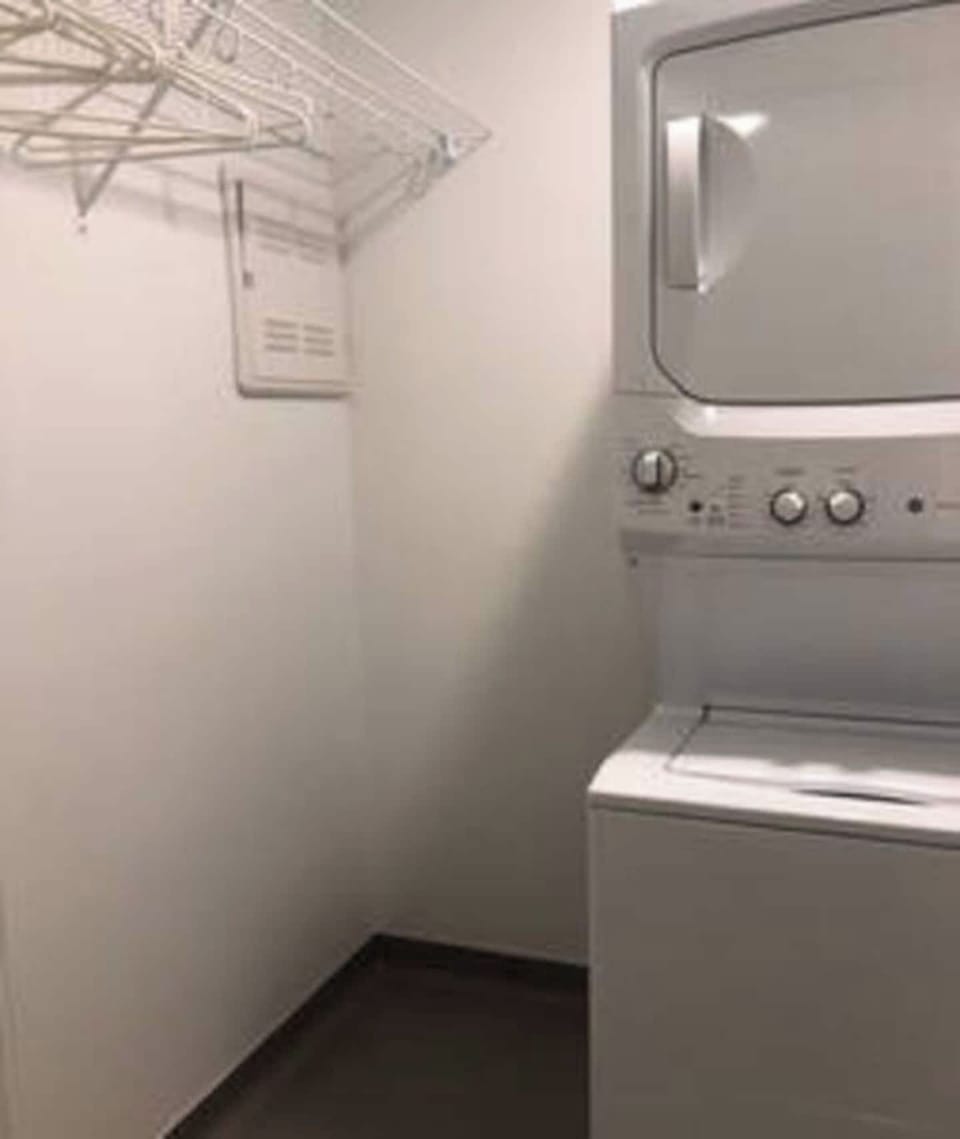 In loft washer and dryer and storage space
