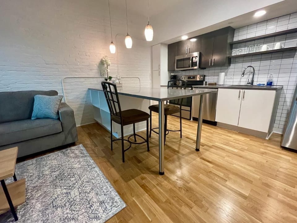 Eat in kitchen with stainless steel appliances and furnished kitchen.  