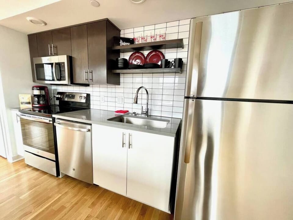 Full kitchen with stainless steel appliances.