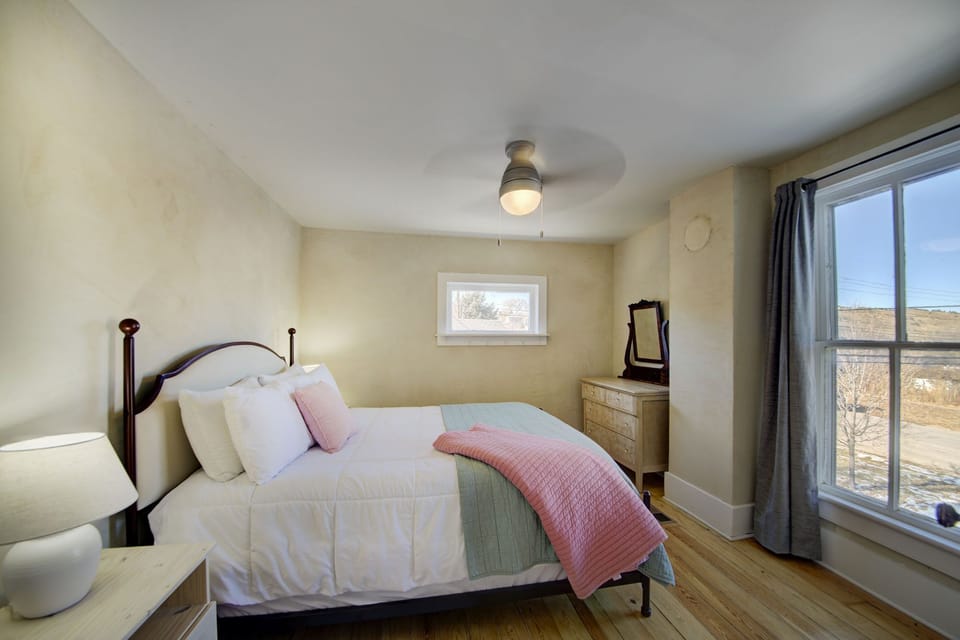 Bedroom 2 with views of M Hill, known for excellent mountain biking & hiking!