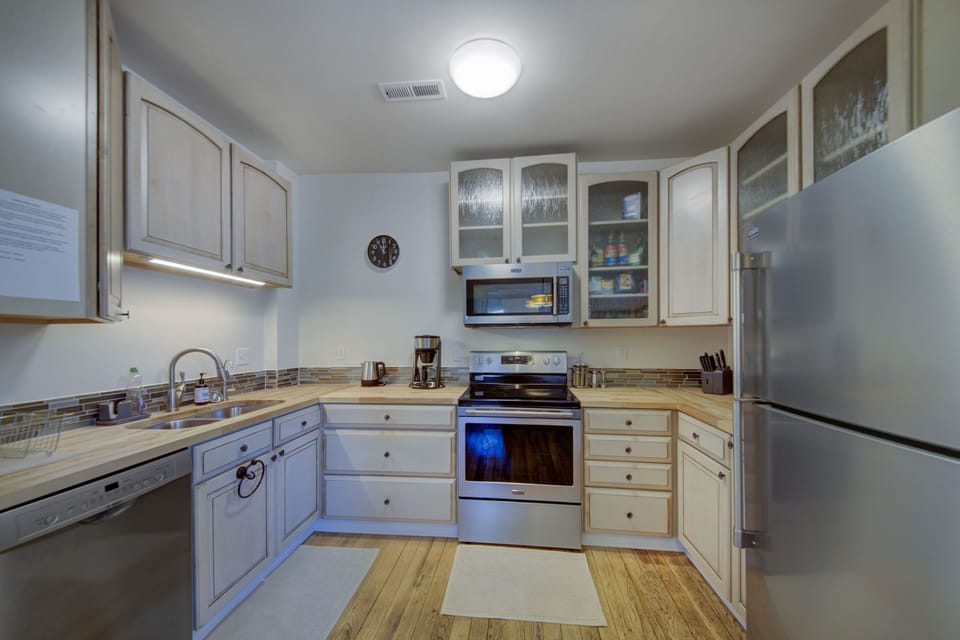 Fully stocked, high quality baking & cookware. Main level kitchen.
