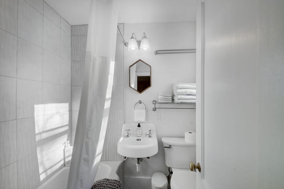 En suite bathroom to Bedroom 1. Additional half bathroom on main level.