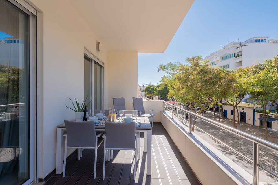 Spacious balcony with outdoor furniture