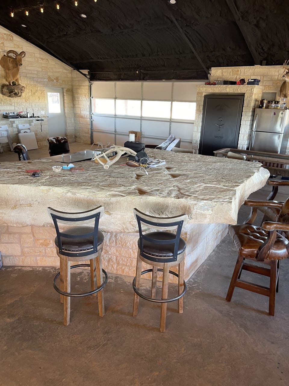 Huge limestone bar, sourced off the ranch and handcrafted by owner. 