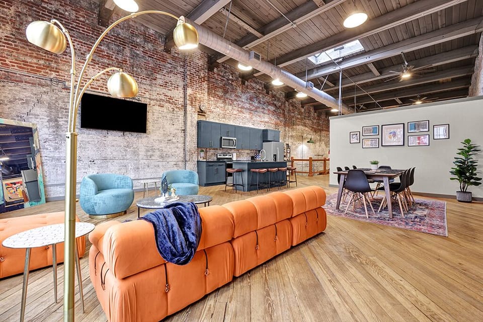 Orange couch replaced to add more seating and comfort.