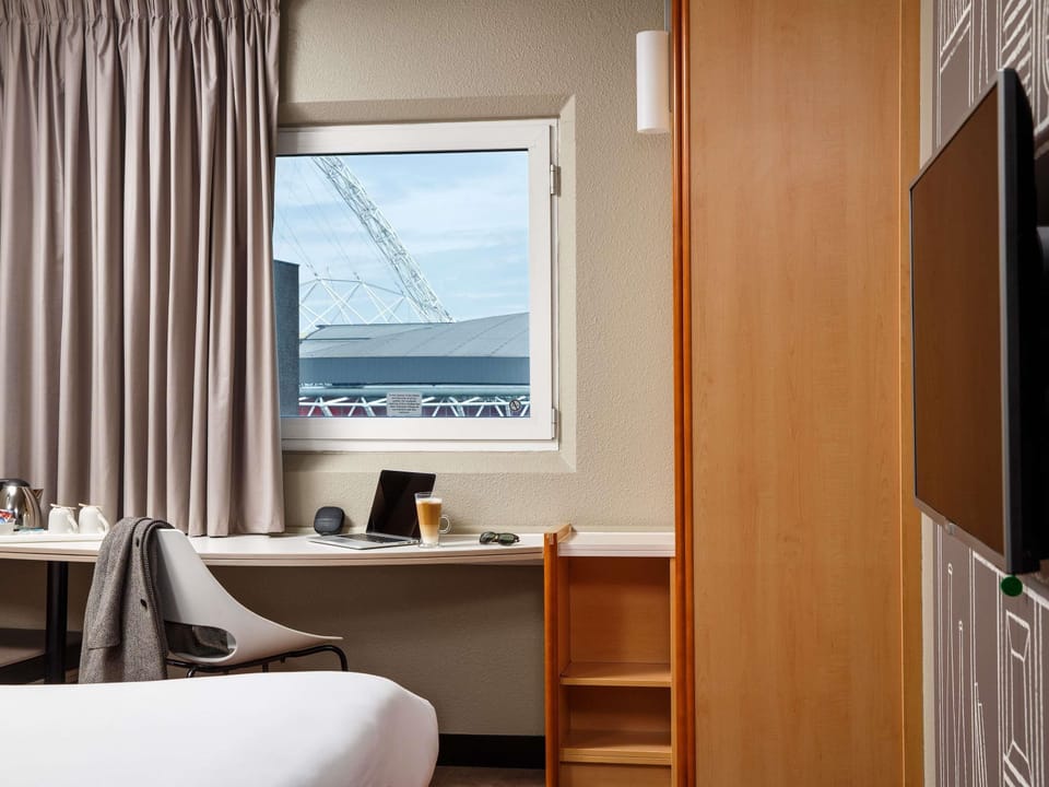 Hypo-allergenic bedding, desk, blackout drapes, iron/ironing board