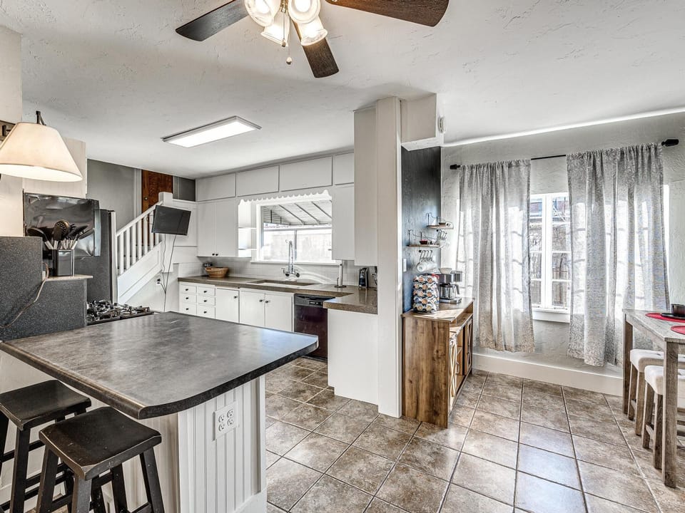 The kitchen provides for some less formal seating.