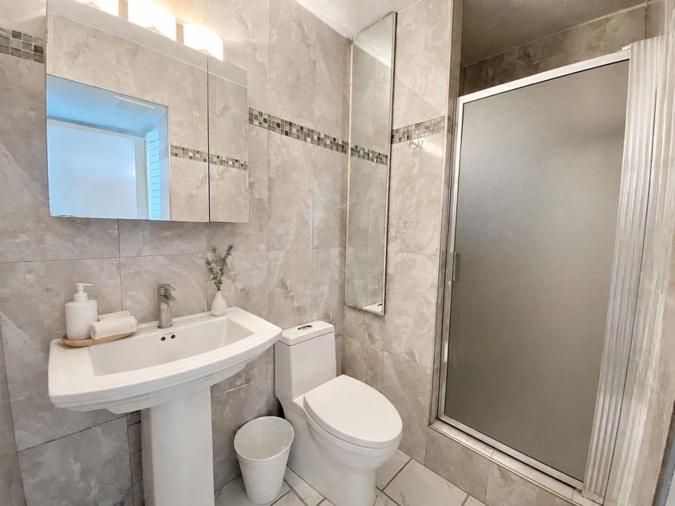 A bright and convenient second bathroom, perfect for refreshing and getting ready for another day in paradise.