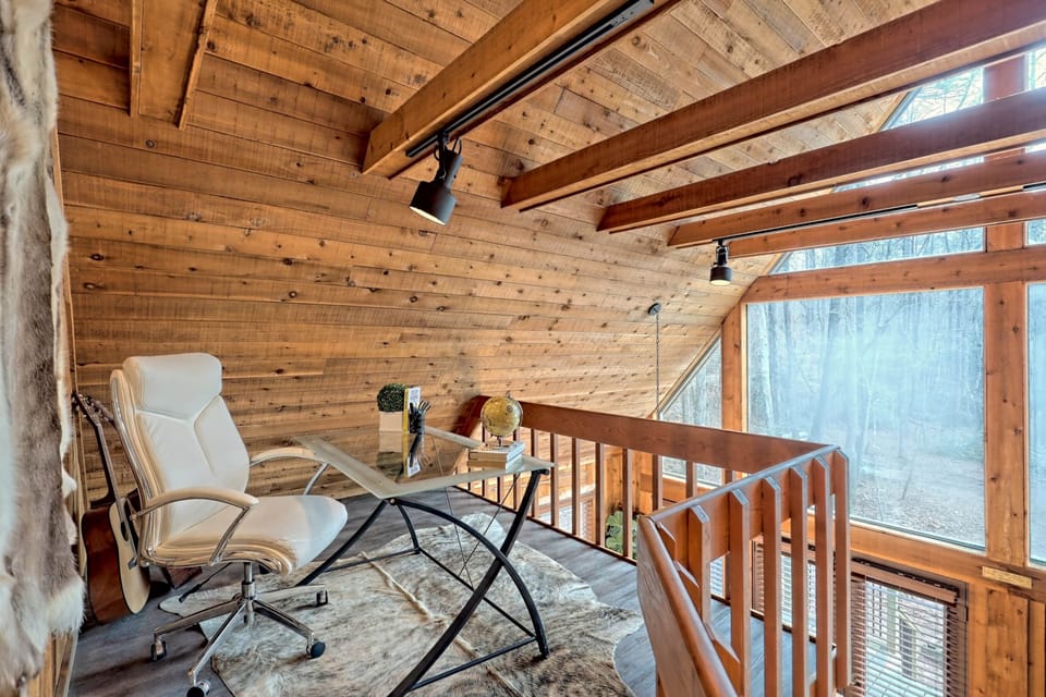 Imagine how productive you'd be working remotely in this loft cabin office. 