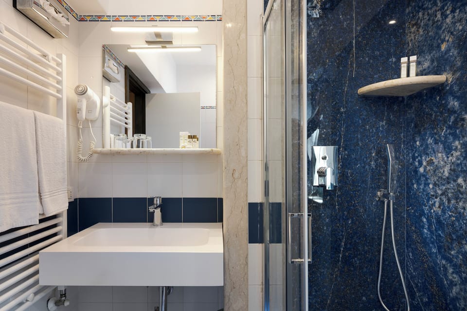 Standard Double Room, Sea View | Bathroom | Shower, designer toiletries, hair dryer, towels