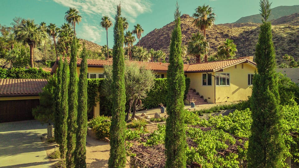 Long private and gated driveway leading to the entrance of the property. 