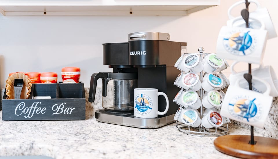 [Coffee Station] Indulge in the perfect morning ritual at our coffee station. Wake up to the aroma of freshly brewed delight, complete with a coffee maker and a selection of Keurig pods. Your perfect day starts here.