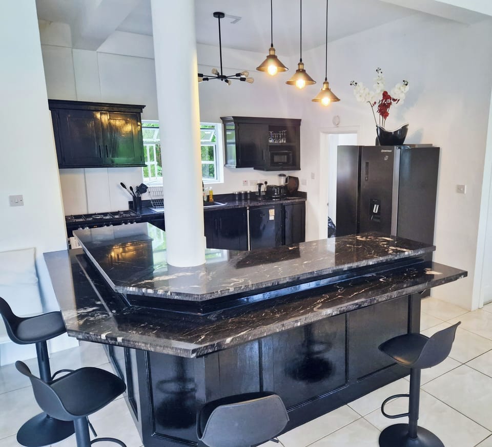 Modern furnished kitchen. 5 burner stove, electric over, dishwasher & fridge