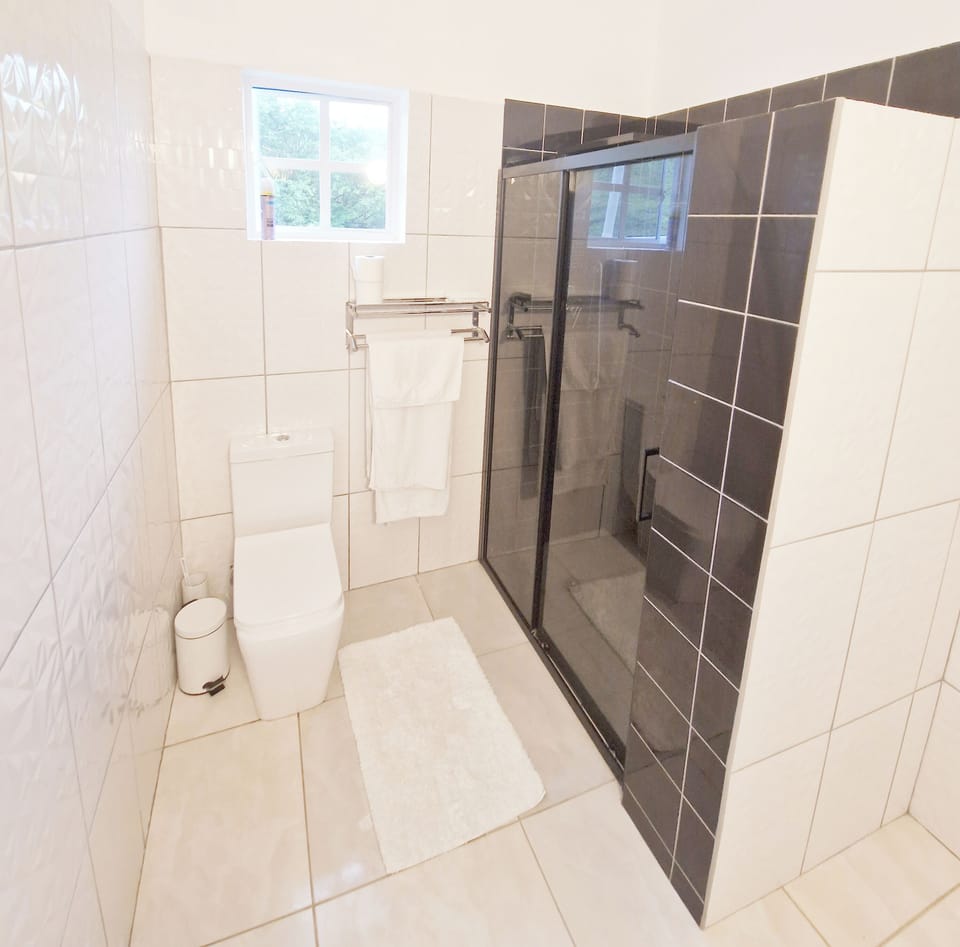 Bathroom 2  on the upper floor. Large tank private tank services the property