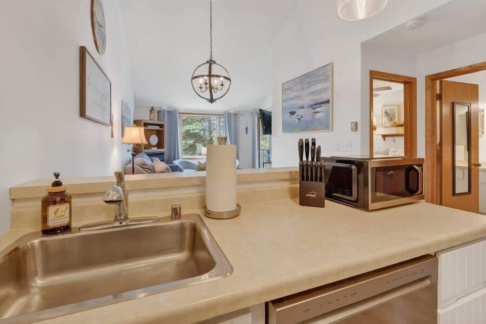 The warm, open kitchen flows seamlessly into your cozy living space, offering everything you need to feel right at home during your stay.