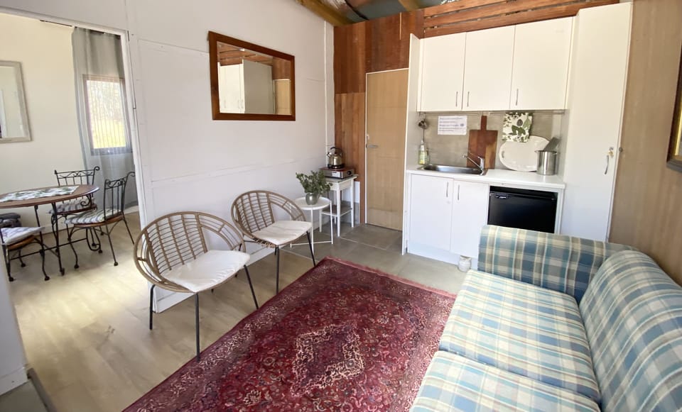 Living area with a double bed sofa 
