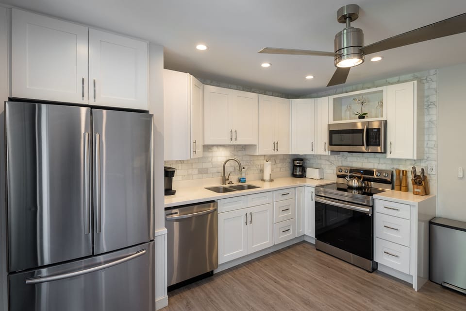 Our kitchen is stocked with a dishwasher, utensils and coffee maker and Keurig.
