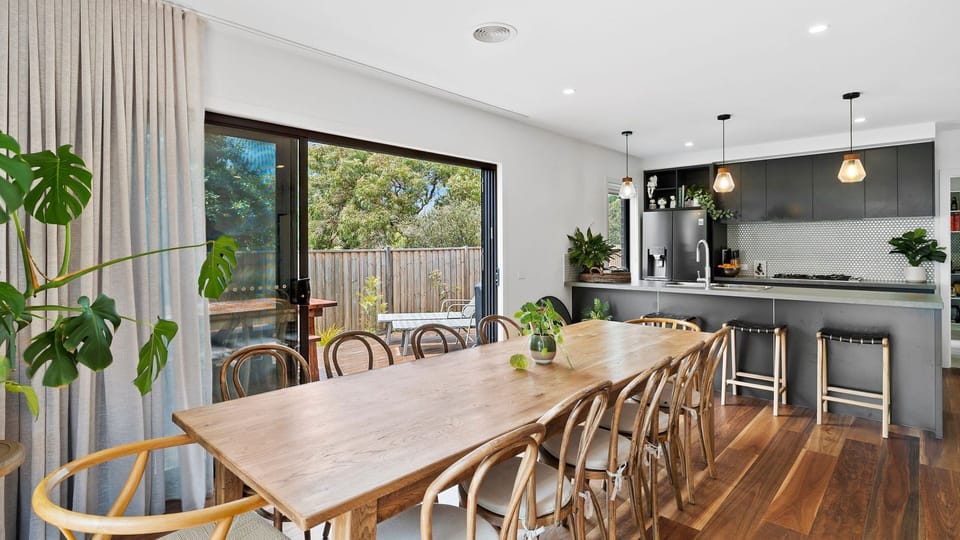 Next to the first living room are the dining and kitchen areas.