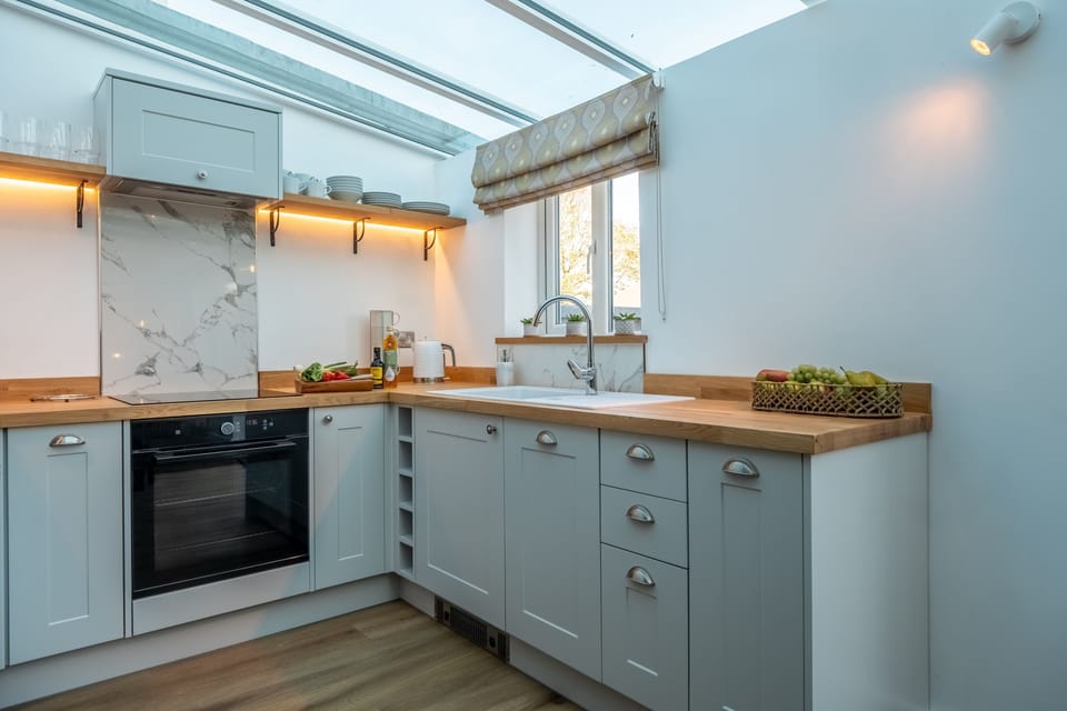 Ground floor: Kitchen with electric oven and hob, microwave, dishwasher and fridge-freezer